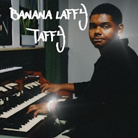 a man sitting in front of an organ